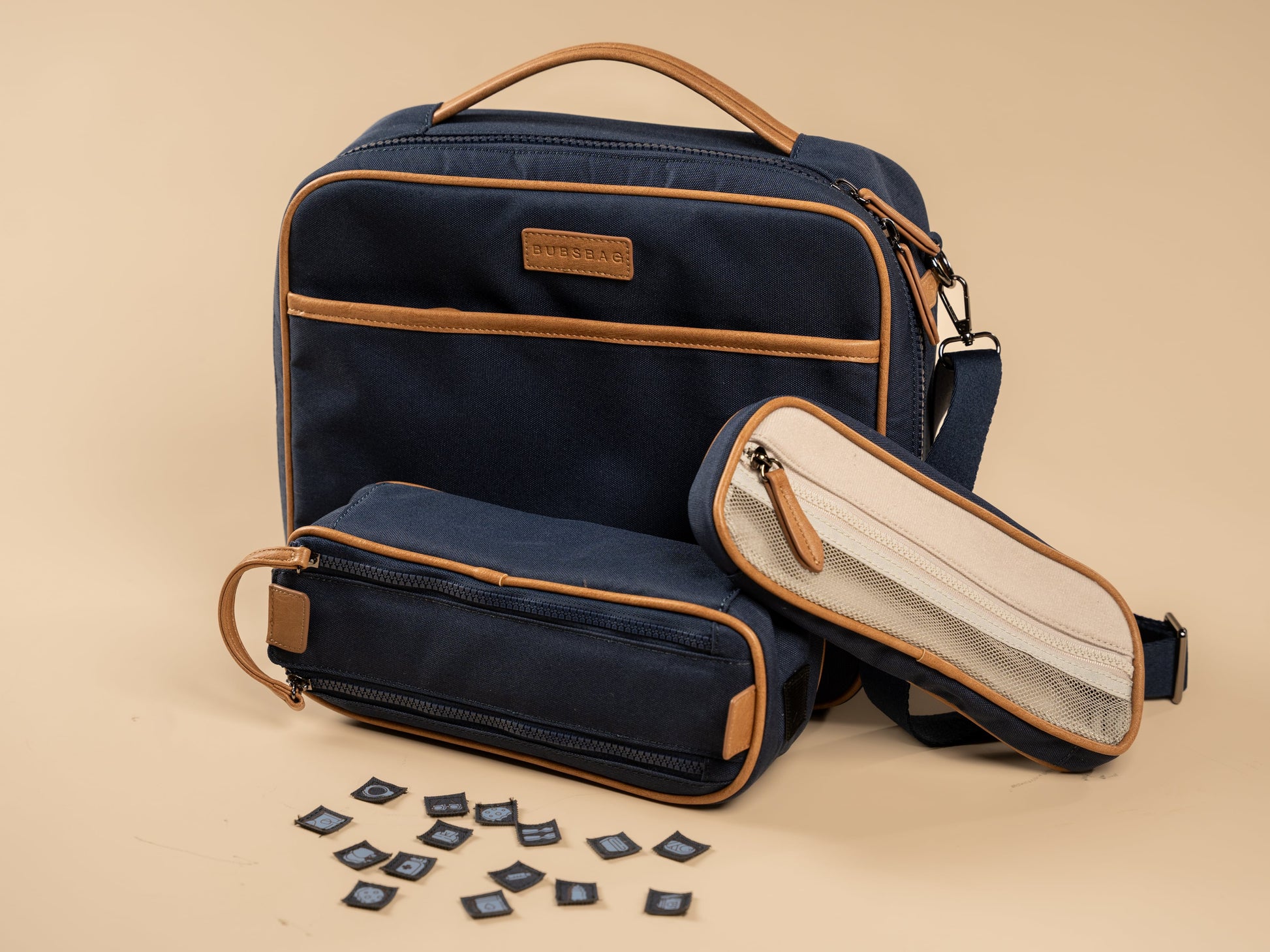 Organized navy nappy bag with removable dividers and labeled compartments
