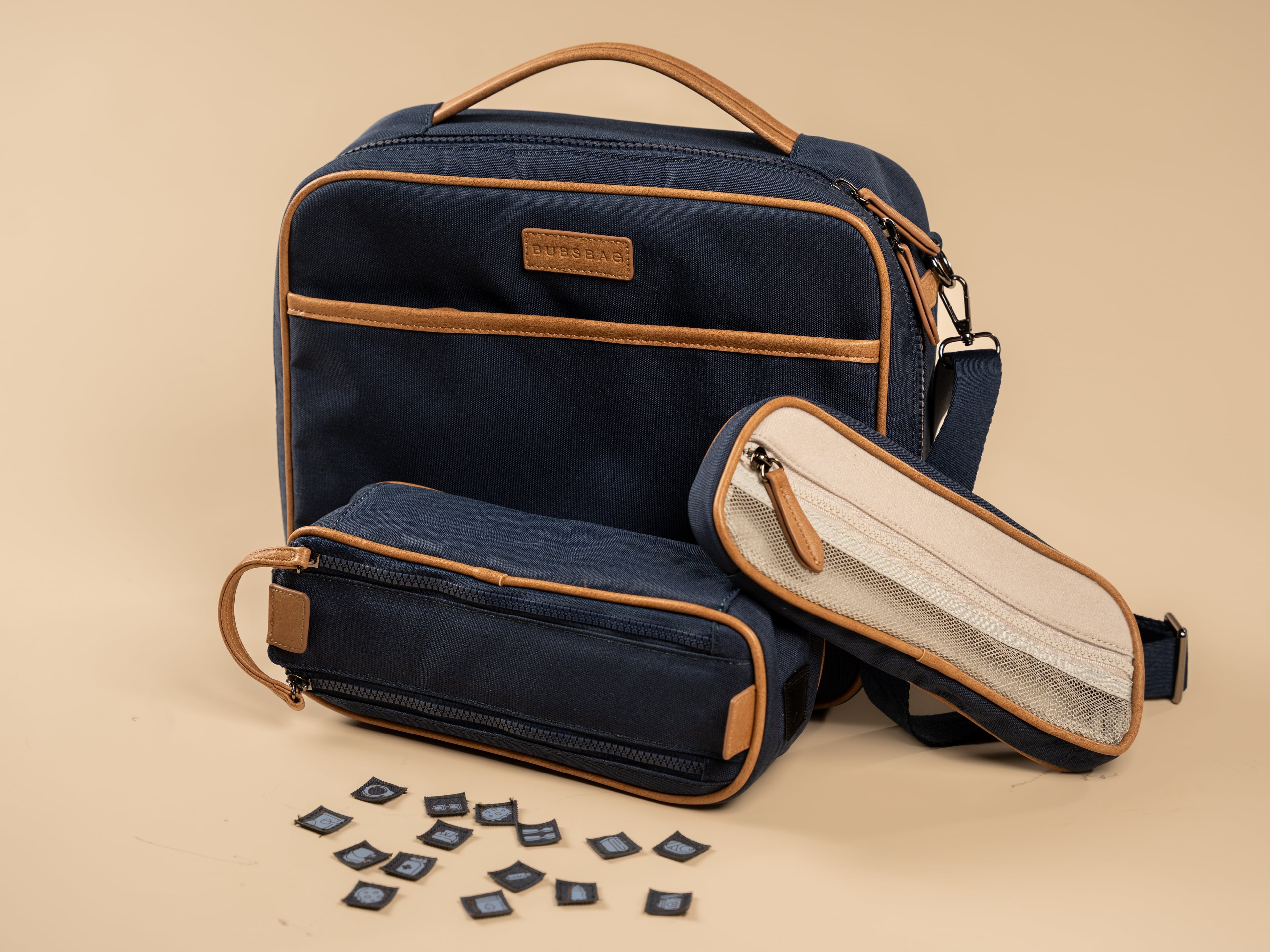 Organized navy nappy bag with removable dividers and labeled compartments