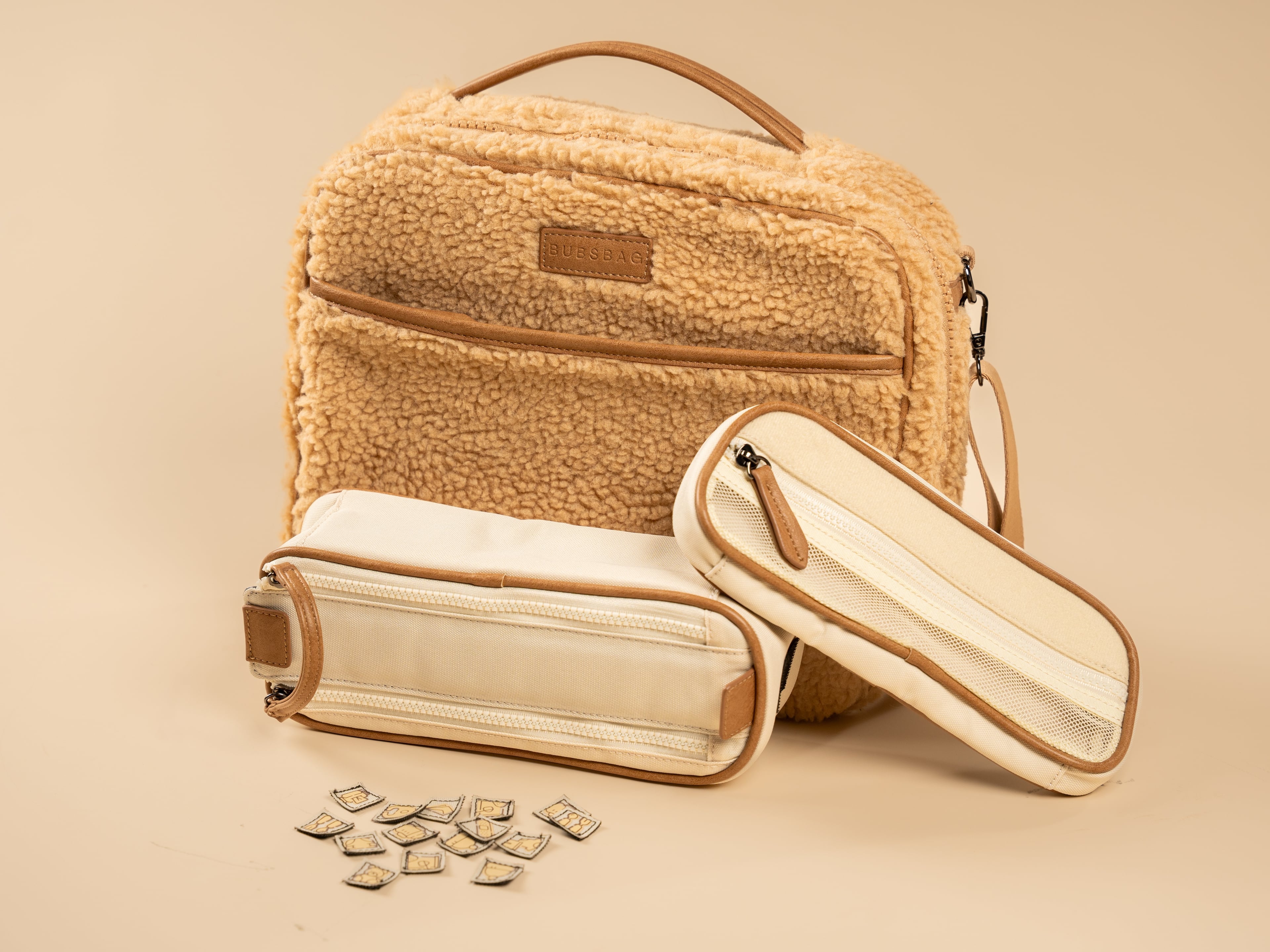 Organized navy nappy bag with removable dividers and labeled compartments