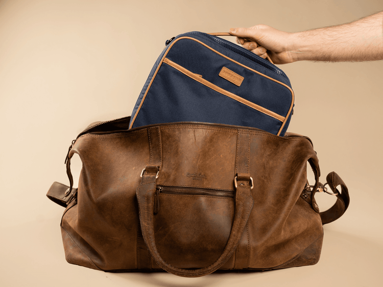 Compact organized diaper bag designed to fit inside larger luggage