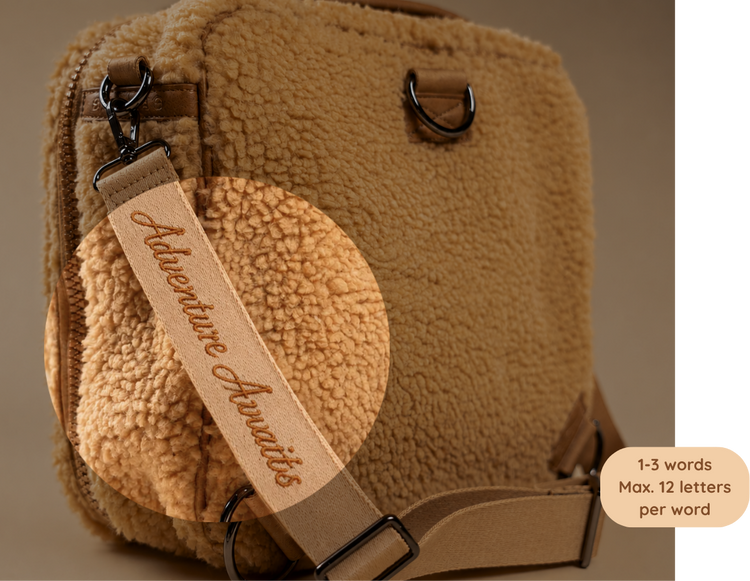 Custom embroidered shoulder strap wth tagline for the BUBSBAG teddy diaper bag
