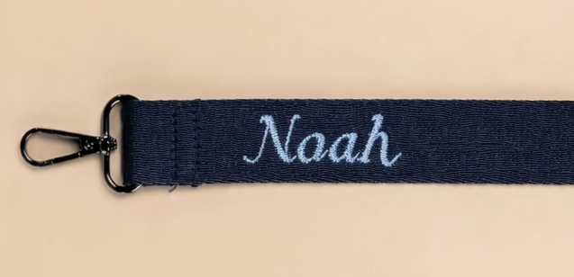 Personalized diaper bag strap with embroidered baby name Noah
