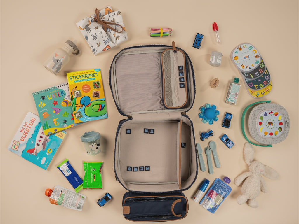 Load video: Open BUBSBAG packed with organized baby essentials for an airplane trip