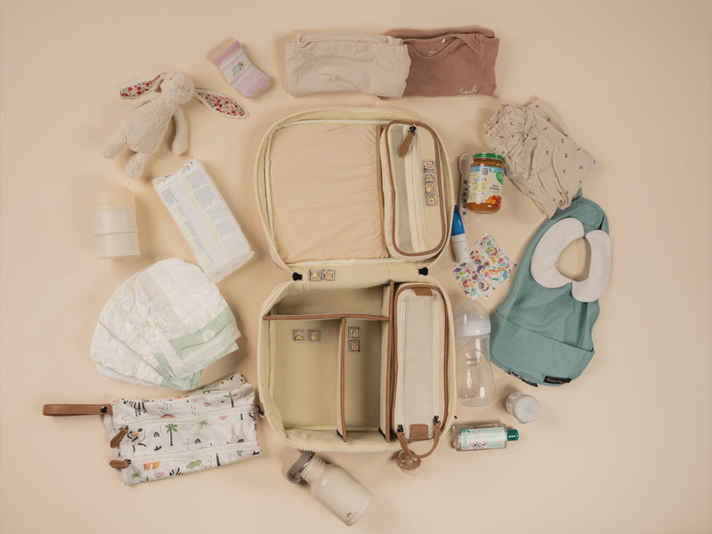 Open BUBSBAG packed with organized baby essentials for a picnick