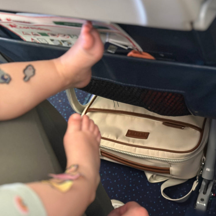Compact organized baby travel bag fitting under an airplane seat